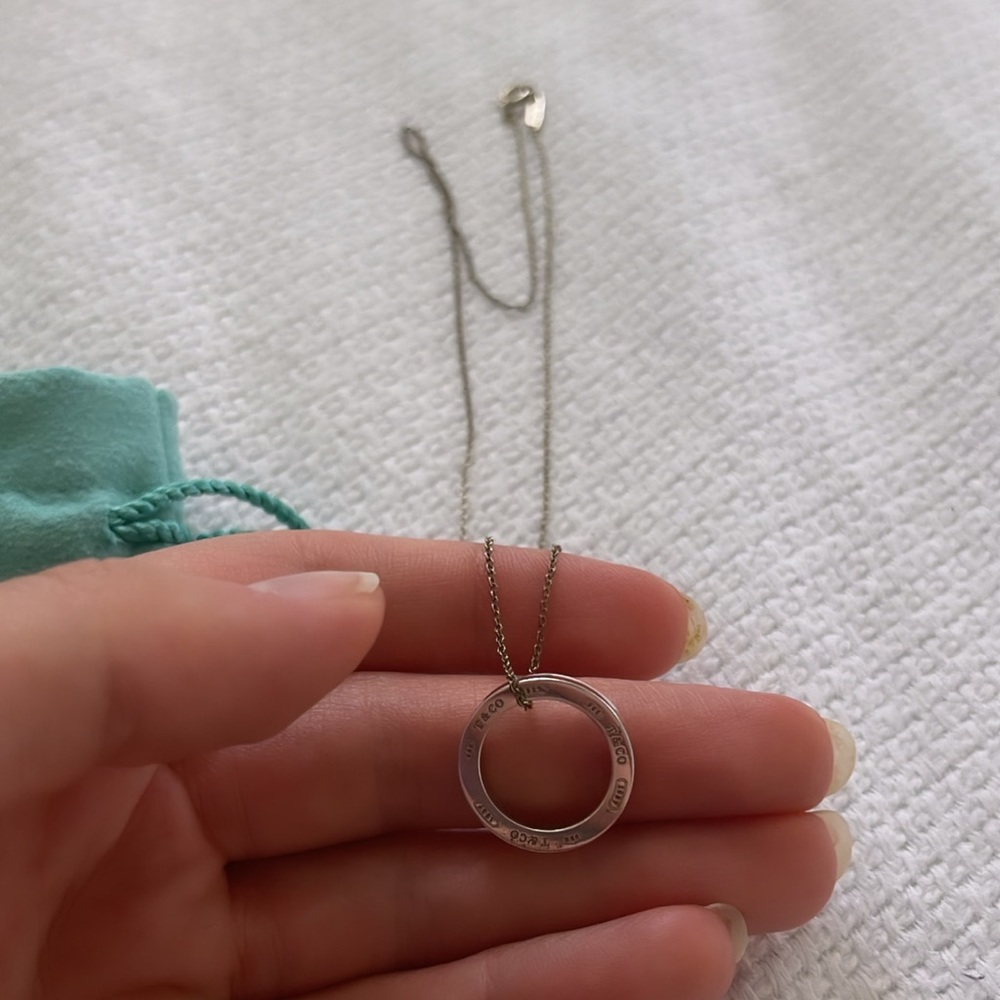 Tiffany & Co circle pendant necklace with bag